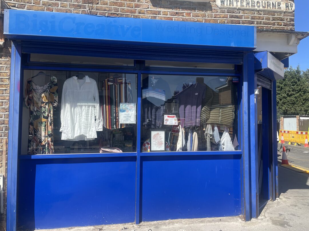 The shop's blue corner frontage on Winterbourne Road, seen from the pavement