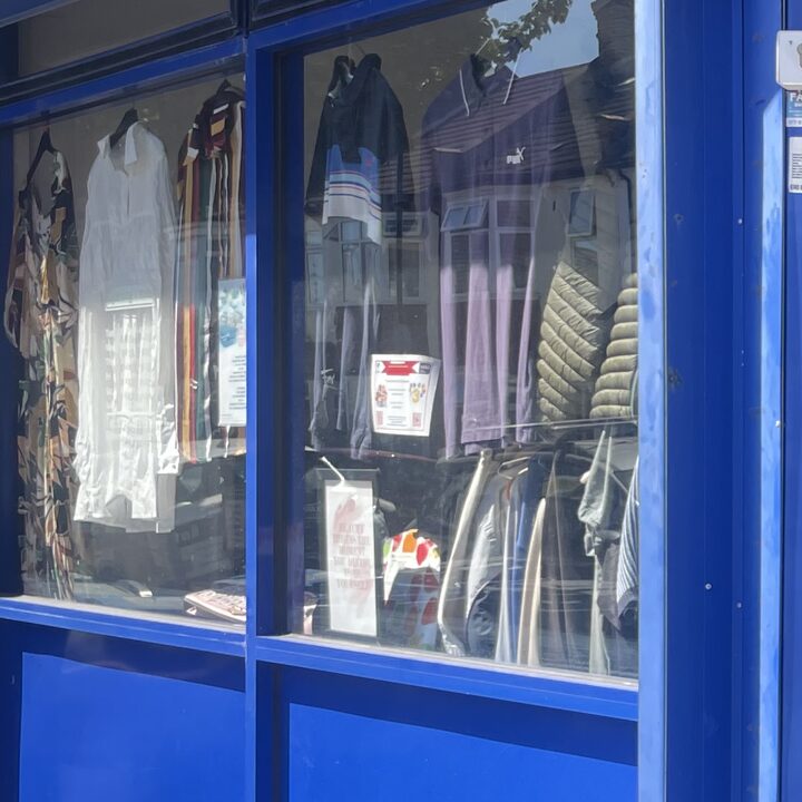 Rails of jackets and shirts filling the shop window