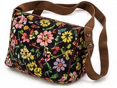 A floral-patterned shoulder bag with a brown strap