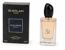 A boxed Guerlain Shalimar perfume beside a Si eau de parfum bottle