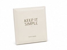 A small cream canvas print reading 'Keep It Simple'