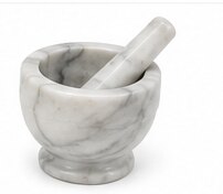 A white marble mortar and pestle